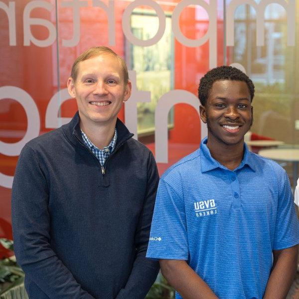 two people pictured standing next to each other with arms in front: Jourdan Watson and Ben Nanninga